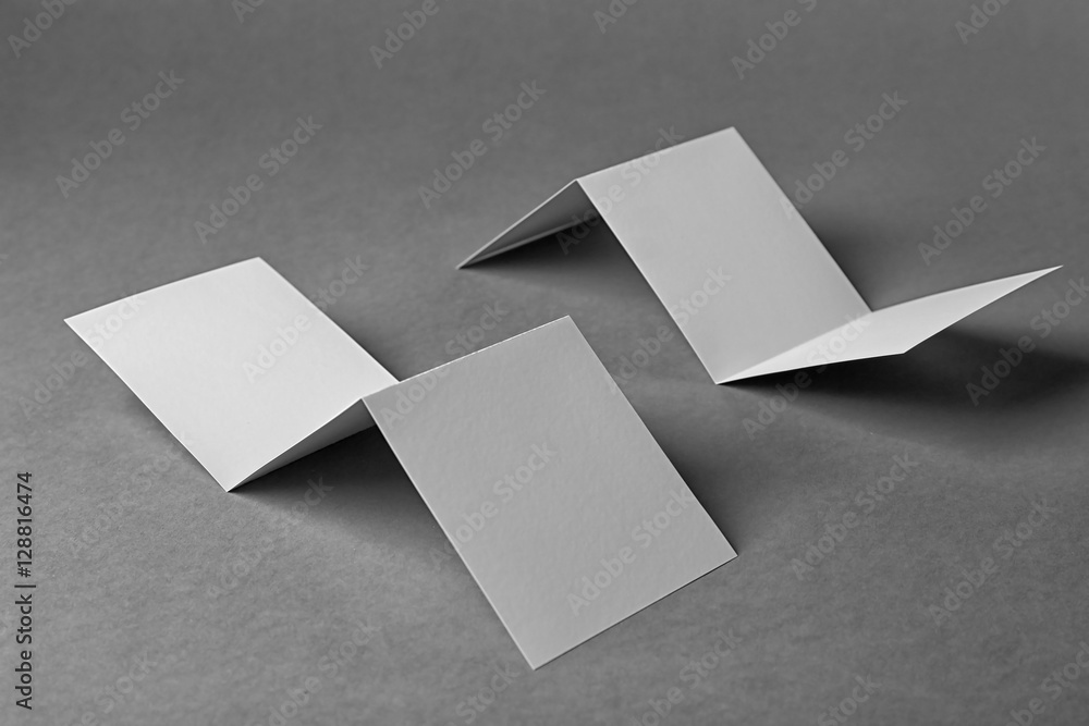 Blank booklets on grey background Blank booklets on grey background