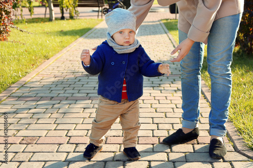 Cute little baby with mothe...