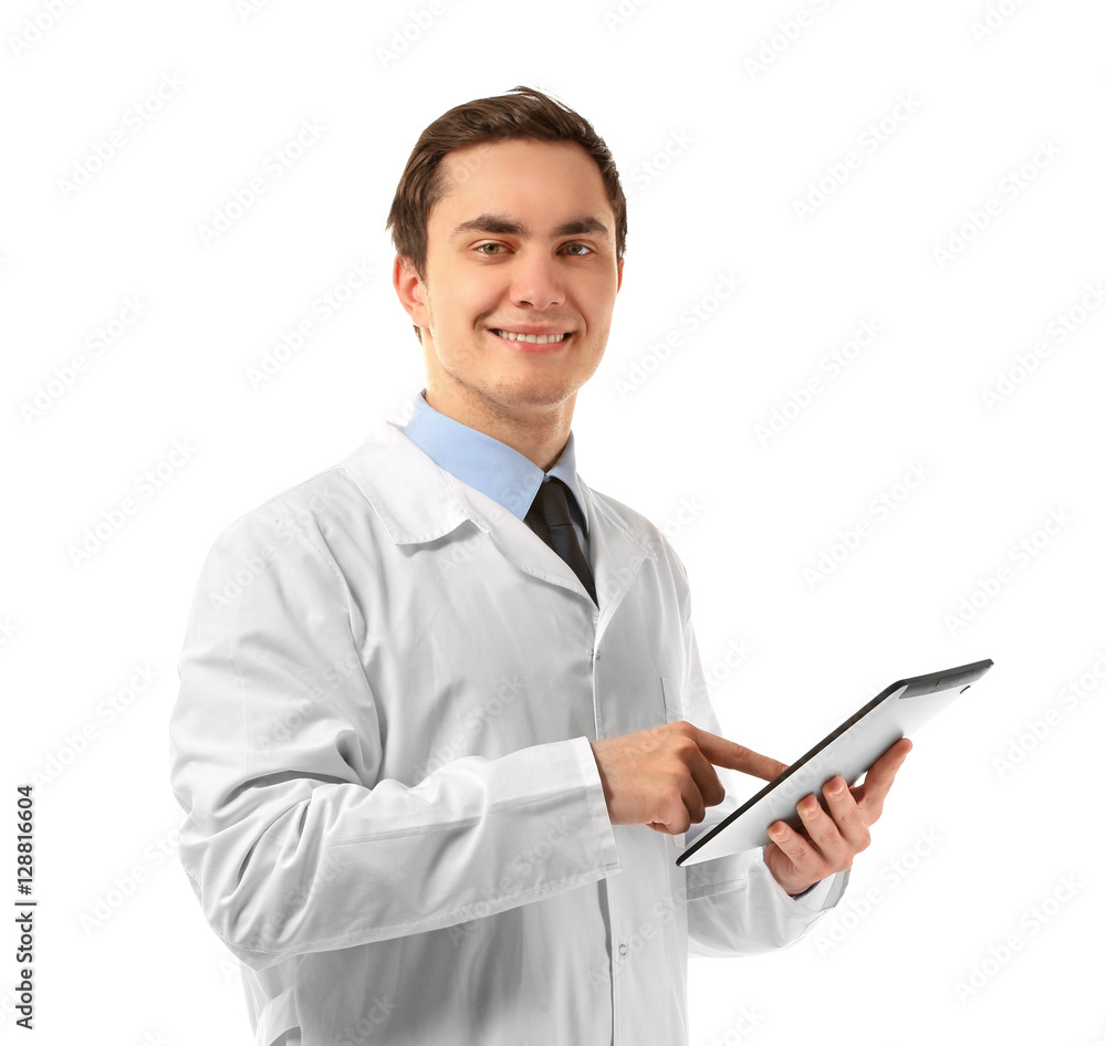 Young male doctor with tablet on white background