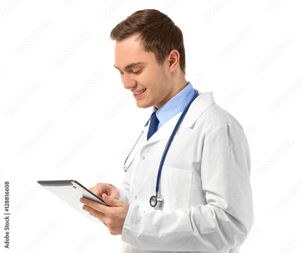 Young male doctor with tablet on white background Young male doctor with tablet on white background
