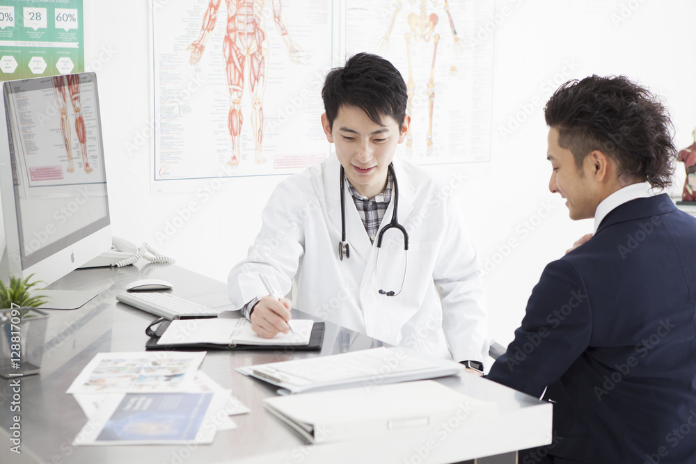 Young businessman is undergoing a medical examination Young businessman is undergoing a medical examination