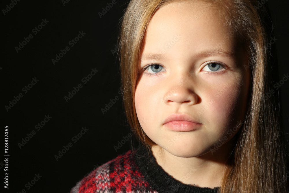 Portrait of cute little girl on black background Portrait of cute little girl on black background