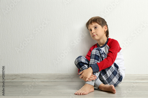 Cute little boy sitting on ...