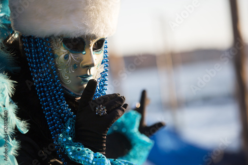 Mask during venice carnival in St. Marco Square, Venice, Italy photo