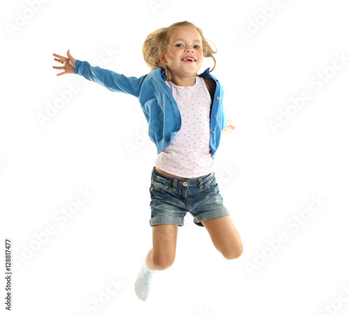 Funny little girl jumping o...