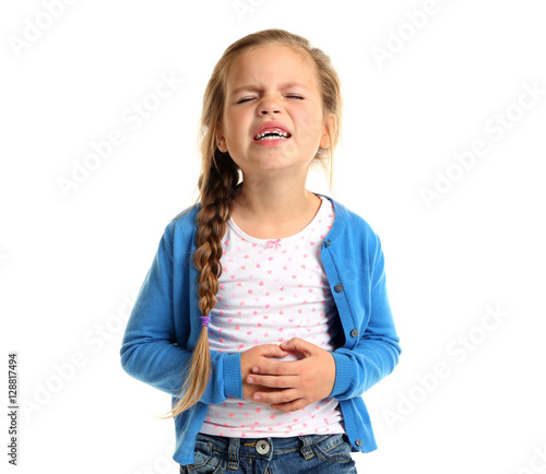Tableau sur toile Cute little girl suffering from stomach ache, isolated on white