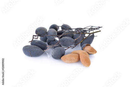 whole and peeled Velvet tamarind (Dialium cochinchinense) with s photo