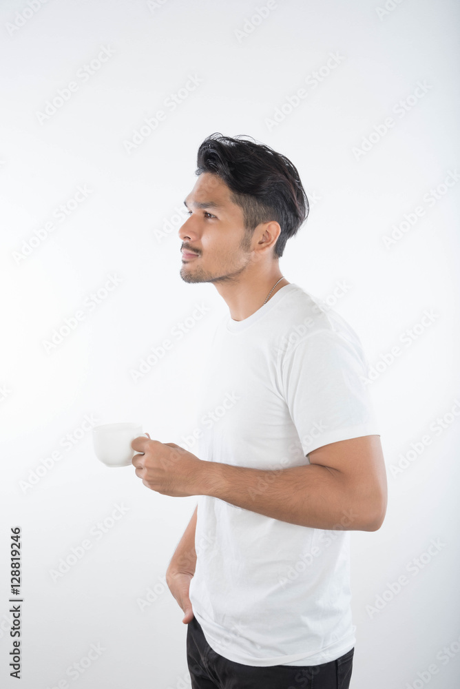 Portrait of happy young man drinking coffice on white background Portrait of happy young man drinking coffice on white background