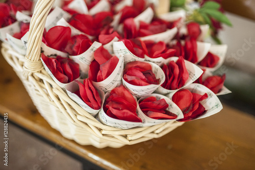 Basket full of cornets filled with red rose for wedding
