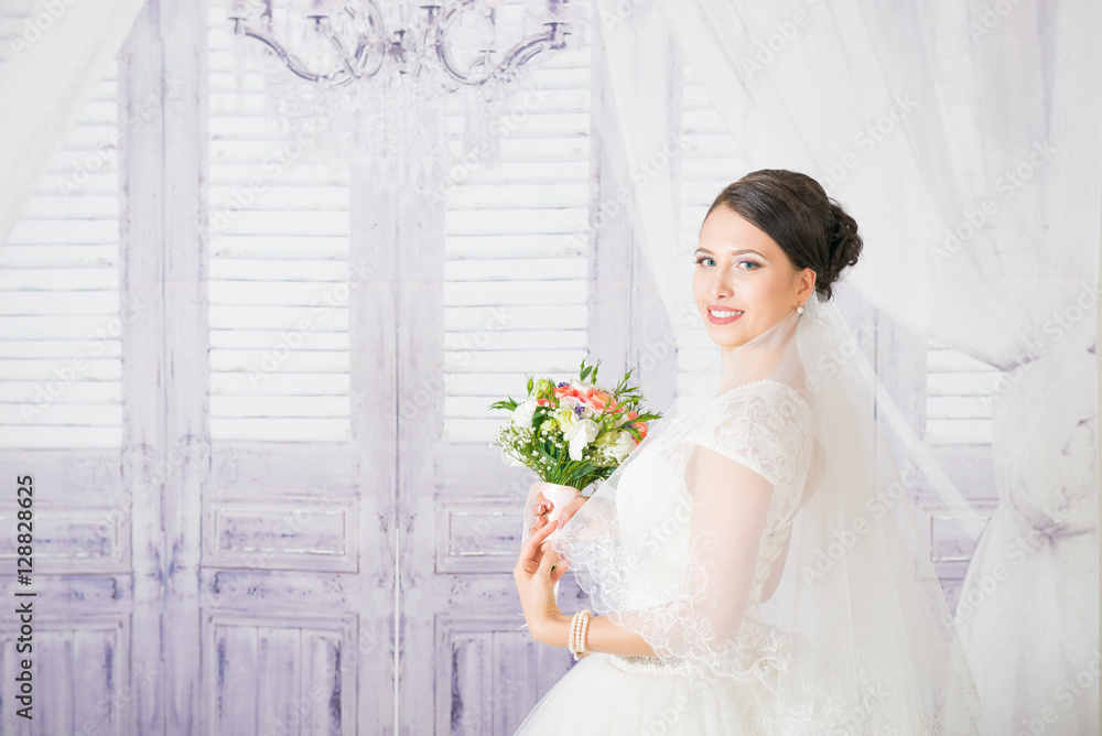 Beautiful bride with wedding hairstyle. Closeup portrait of young bride. Wedding. Beautiful bride portrait with veil over her face. Beautiful bride in veil on the wedding day
Beautiful bride with wedding hairstyle. Closeup portrait of young bride. Wedding. Beautiful bride portrait with veil over her face. Beautiful bride in veil on the wedding day