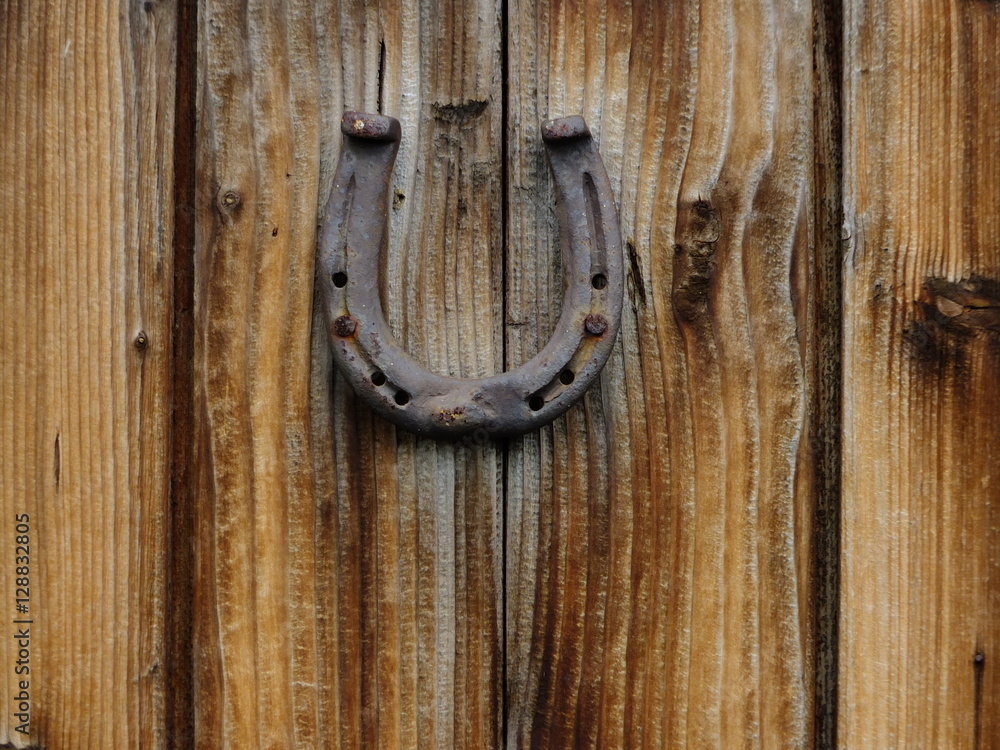 horseshoe hanging on wood door horseshoe hanging on wood door