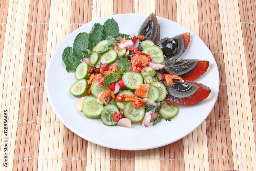 Spicy cucumber salad with dried shrimp and  preserved egg.