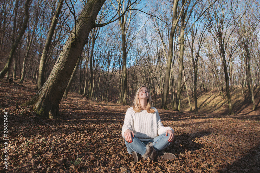 Fototapeta premium Young woman relaxing outdoor in forest