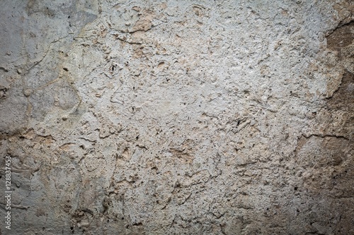 Old destroyed concrete wall with uneven structure