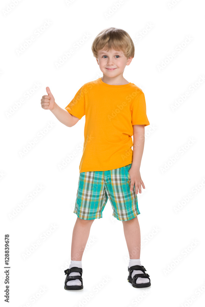 Little blond boy holds his thumb up Little blond boy holds his thumb up