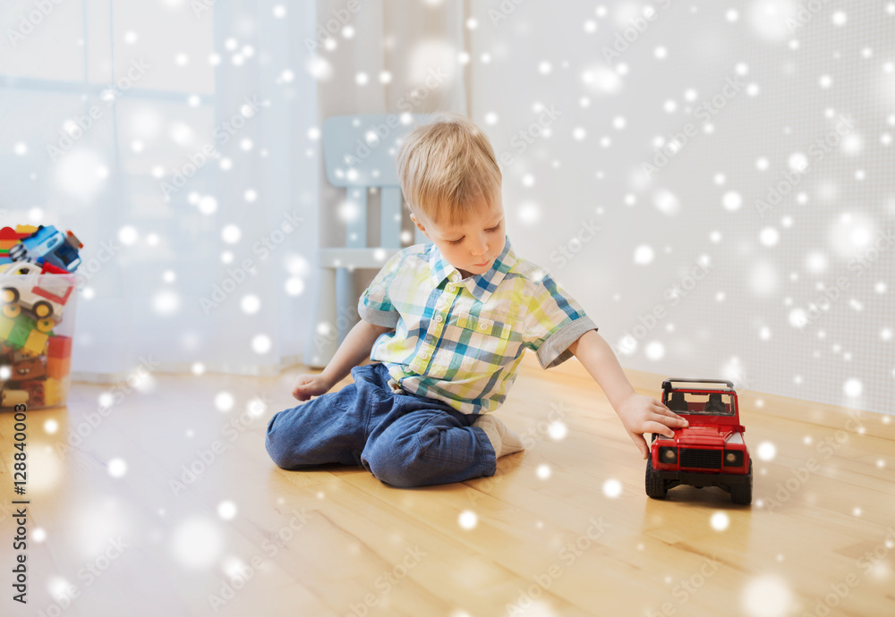 little baby boy playing with toy car at home Stock Photo | Adobe Stock