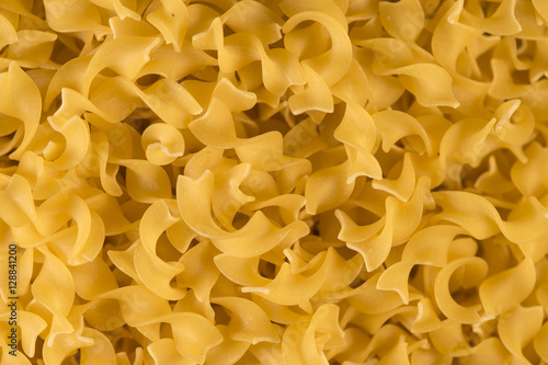 Full background of dry uncooked pasta