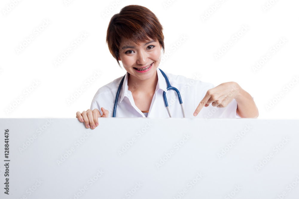 Young Asian female doctor point down to blank sign. Young Asian female doctor point down to blank sign.
