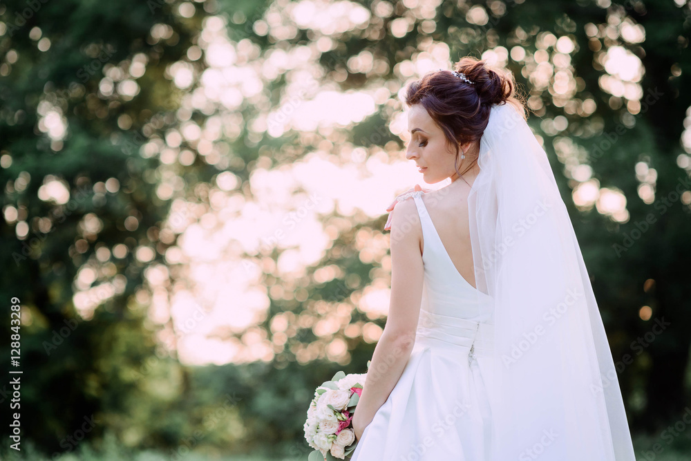 happy and beautiful bride in white dress standing outdoors happy and beautiful bride in white dress standing outdoors