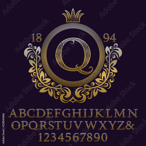 Wavy patterned gold letters and numbers with initial monogram in coat of arms form. Decorative patterned font for logo design. Isolated english vintage alphabet, figures.
