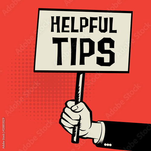 Poster in hand, business concept with text Helpful Tips