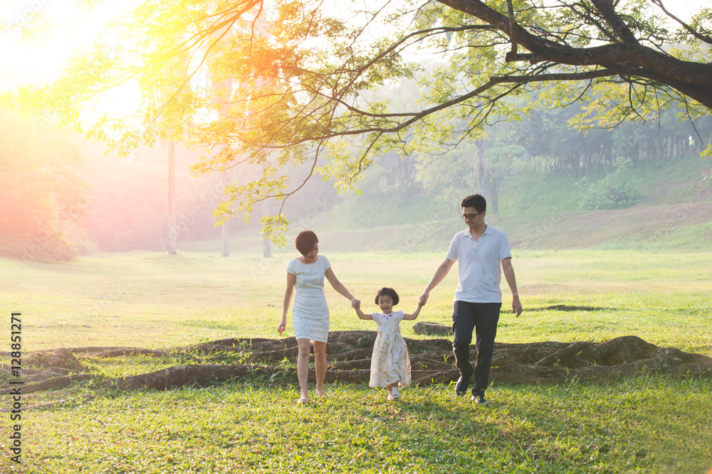 Happy Asian Family enjoying family time together in the park Happy Asian Family enjoying family time together in the park