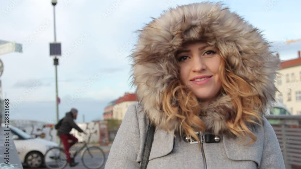 young beautiful girl in winter jacket with fur hood outdoor young beautiful girl in winter jacket with fur hood outdoor