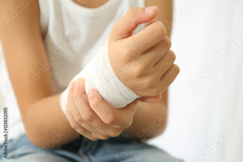 Fotografie Close up view of little boy's wrist with applied bandage
