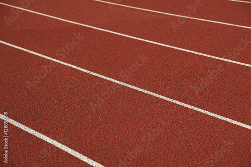 Athletics stadium running track white lines marks.