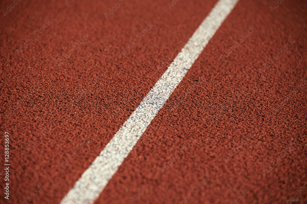 Athletics stadium running track white lines marks.
Athletics stadium running track white lines marks.