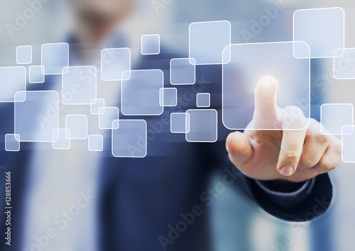 Abstract business concept, businessman touching button on a virtual interface