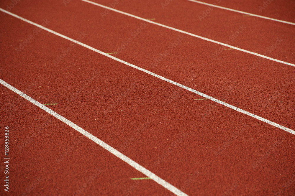 Athletics stadium running track white lines marks.
Athletics stadium running track white lines marks.