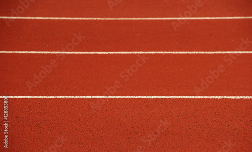 Athletics stadium running track white lines marks.
