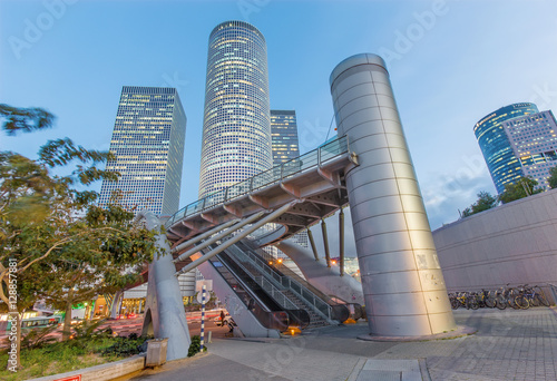 Fototapeta TEL AVIV, ISRAEL - MARCH 2, 2015: The skyscrapers of Azrieli Center in evening dusk by Moore Yaski Sivan Architects with measuring 187 m (614 ft) in height