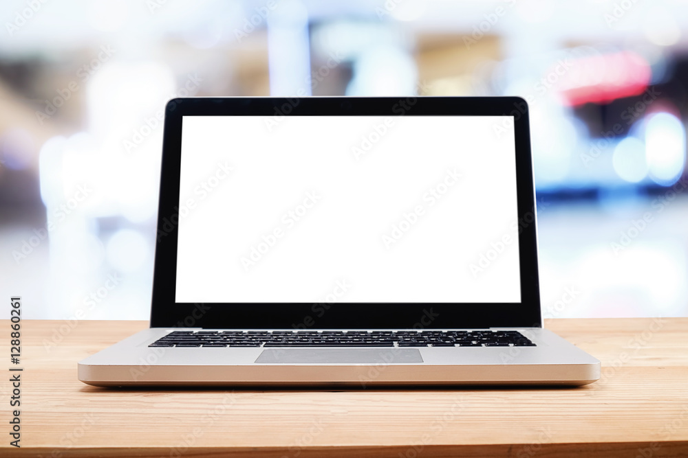Computer with white screen on table with blur background. Technology concept. Computer with white screen on table with blur background. Technology concept.
