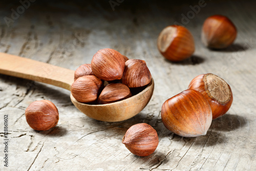 Hazelnut. Fresh organic filbert on wooden background. Nuts macro