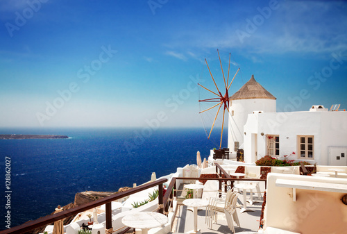 windmill of Oia at sunny day, Santorini island, Greece, retro toned