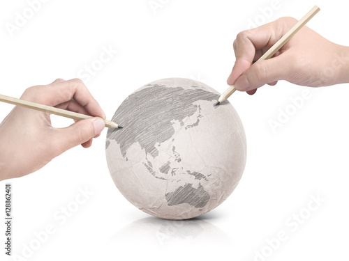 Two hand shade drawing Asia map on paper ball on white background
