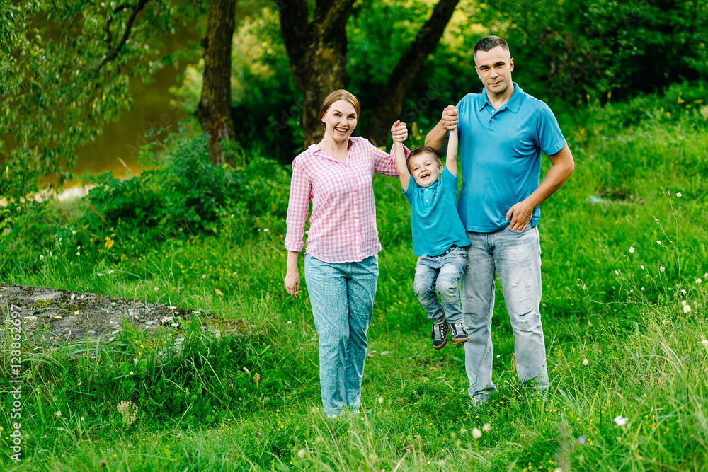 happy family walking in the park playing