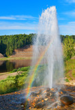 Rainbow in geyser splashes on the Sukhona River in Russia.