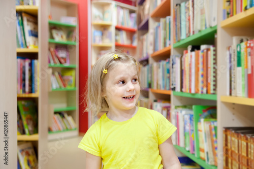 little girl in children's library.