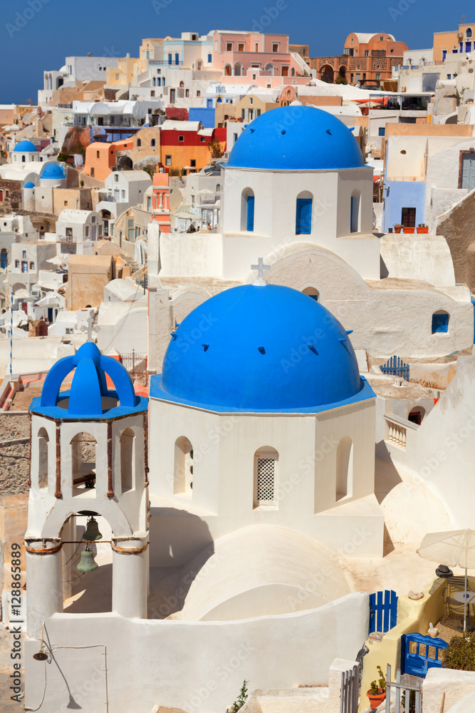 Landscape of Oia town in Santorini, Greece with blue dome church