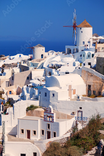 Day panorama of Oia, Santorini with the famous windmill. Vertica