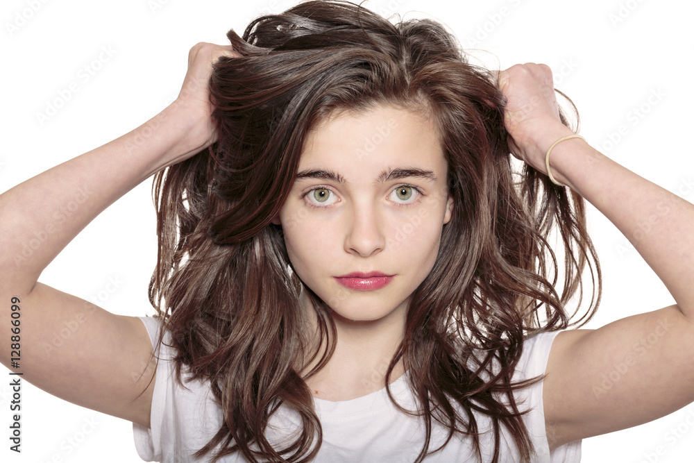 portrait of a teenage girl who is pulling her hair out portrait of a teenage girl who is pulling her hair out