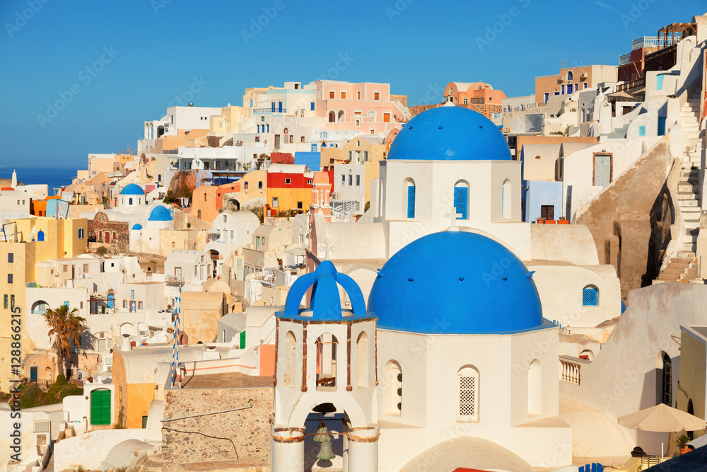 Landscape of Oia town in Santorini, Greece with blue dome church