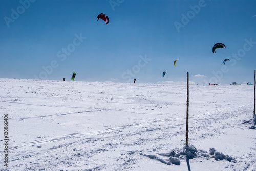 snowkiting on Vysoka hole hill in winter Jeseniky mountains with clear sky