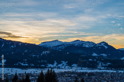 Beautiful sunset in winter with townscape of Oberstdorf, Allgau, Germany photo