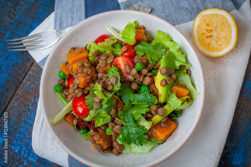 Salad with baked sweet potatoes, avocados, lentils, dried tomatoes, cilantro, pumpkin seeds and oil. . Perfect for the detox diet or just a healthy meal. Love for a healthy raw food concept.