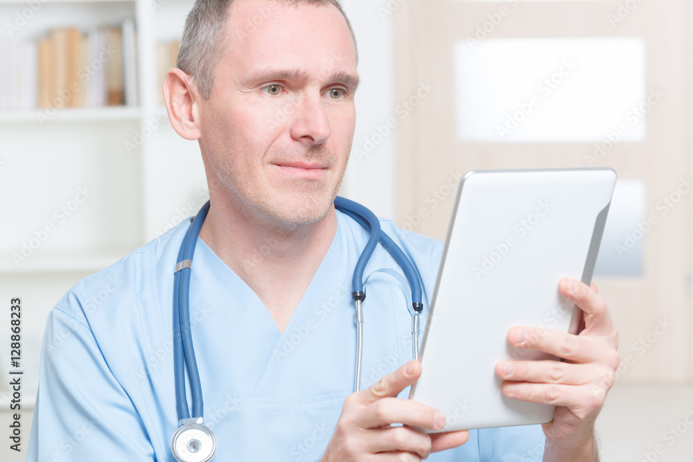 Physician using tablet pc Physician using tablet pc