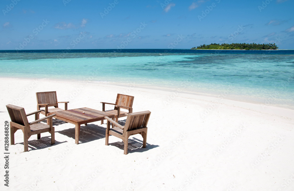 Table and chairs at tropical beach restaurant, Thinadhoo island, Maldives